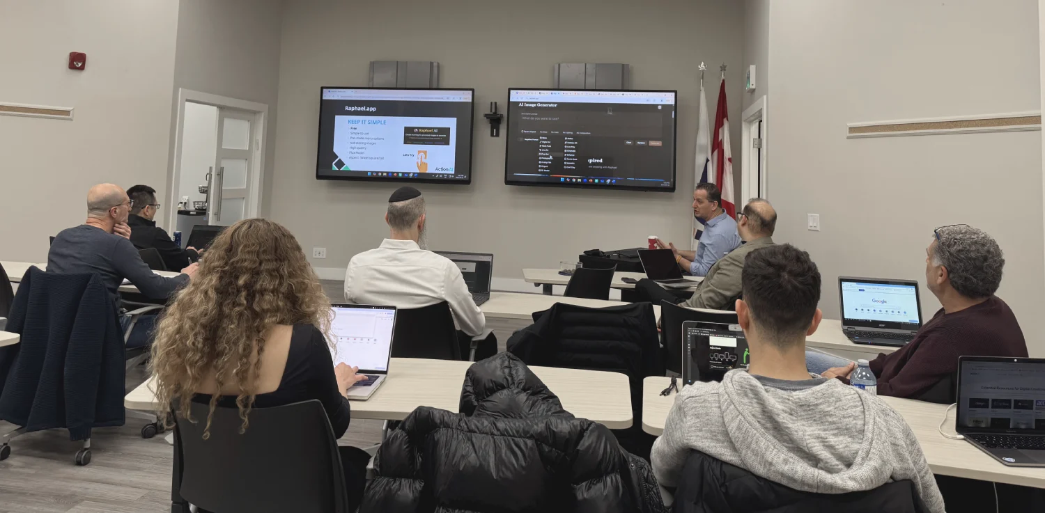 Employees working on their own laptops during Action AI team training in Toronto