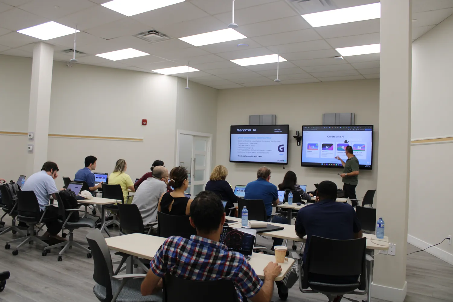 A full room of professionals learning AI together at an Action AI session in Toronto