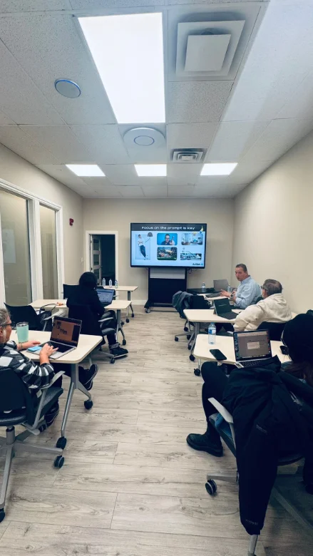 Staff following an Action AI training step by step on their laptops
